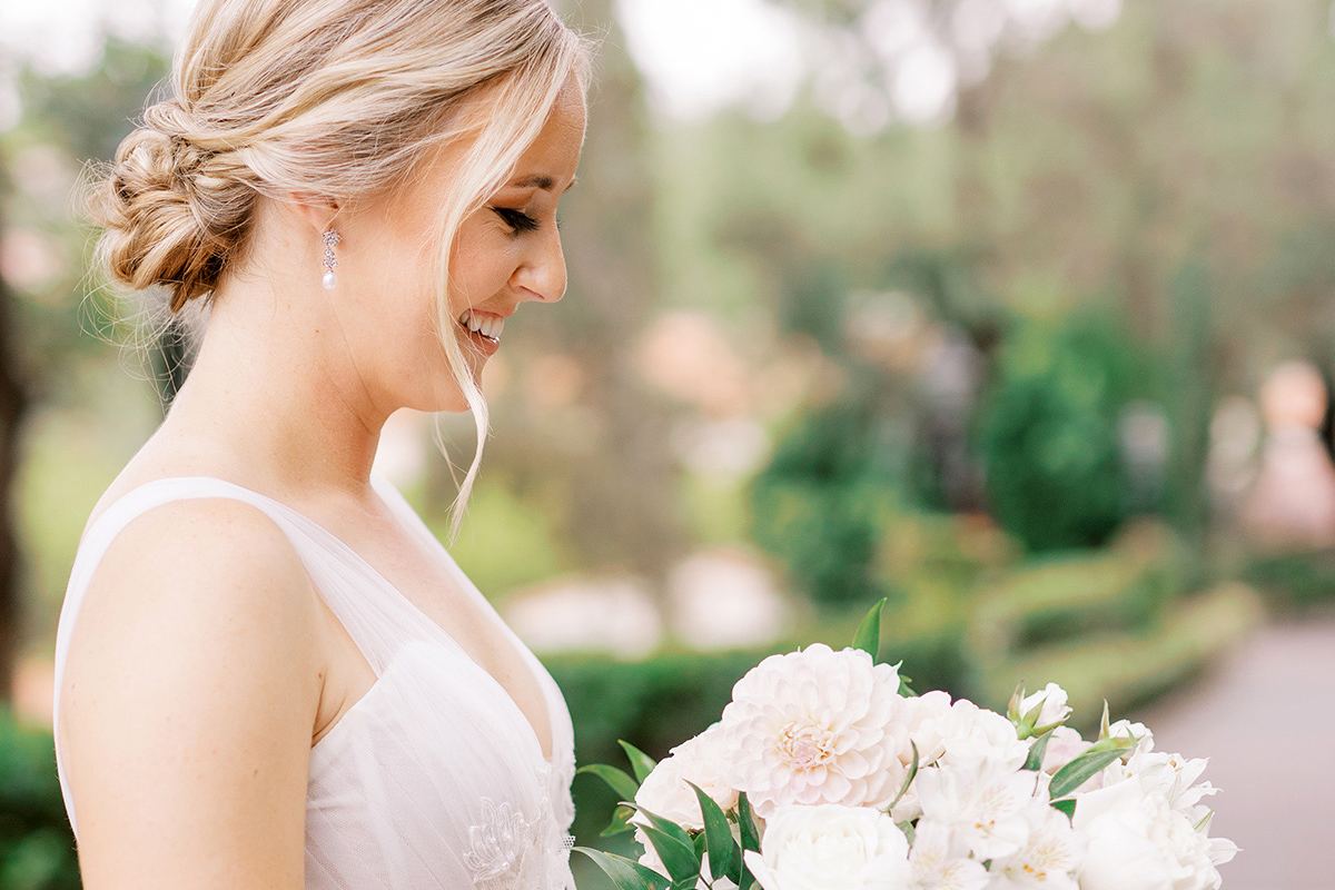 A portrait moment with soft white florals at a Rancho Bernardo Inn wedding in San Diego, planned by Bliss Events.